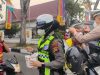 Peduli Dampak Kabut Asap, Polresta Pekanbaru Bagikan 1.300 Masker
